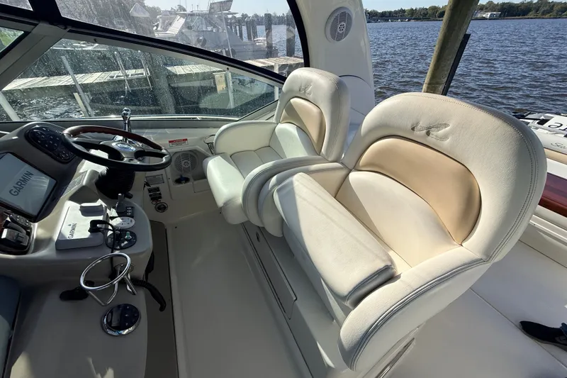 Slide: The Image of Interior of 2008 Sea Ray 340 Sundancer boat with helm and plush seating. - 21