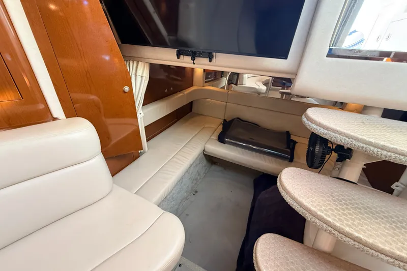 Slide: The Image of Interior of 2008 Sea Ray 340 Sundancer yacht with seating and TV. - 31