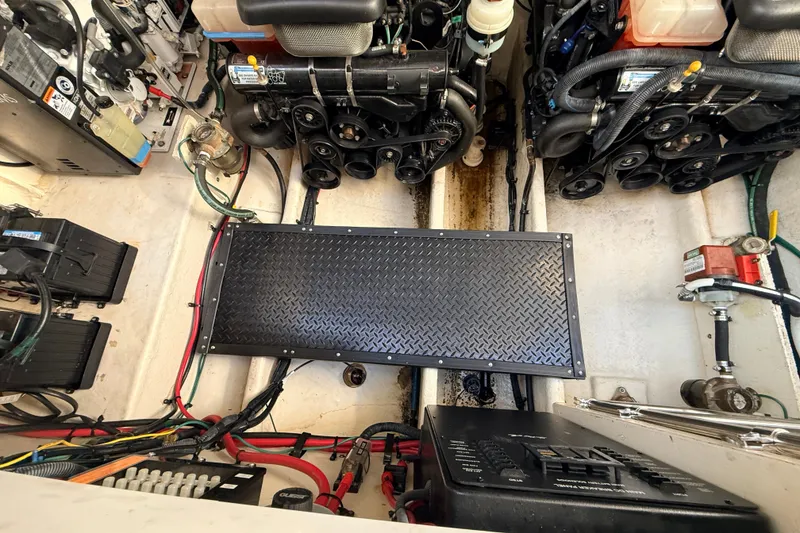 Slide: The Image of Engine compartment of a 2008 Sea Ray 340 Sundancer with visible components and wiring. - 46