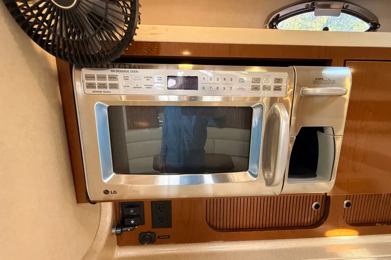 Slide: The Image of LG microwave in 2008 Sea Ray 340 Sundancer yacht kitchen interior. - 33