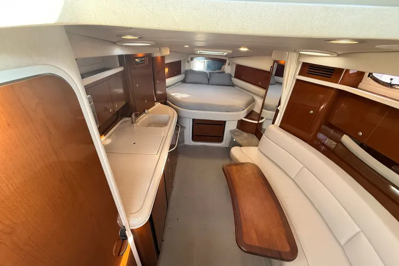 Slide: The Image of Interior of 2008 Sea Ray 340 Sundancer yacht with cozy seating and modern amenities. - 25