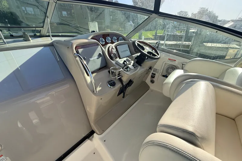 Slide: The Image of Interior cockpit of 2008 Sea Ray 340 Sundancer with steering wheel and navigation equipment. - 22