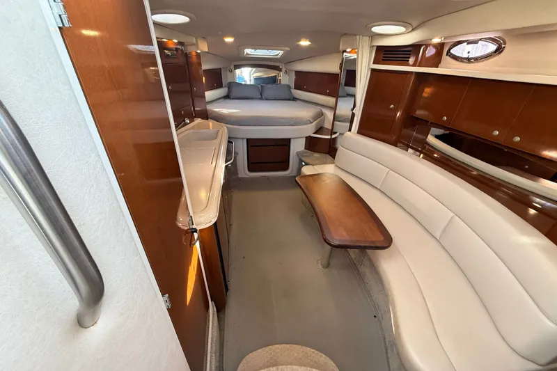 Slide: The Image of Luxurious interior of a 2008 Sea Ray 340 Sundancer yacht with elegant seating and sleeping area. - 26