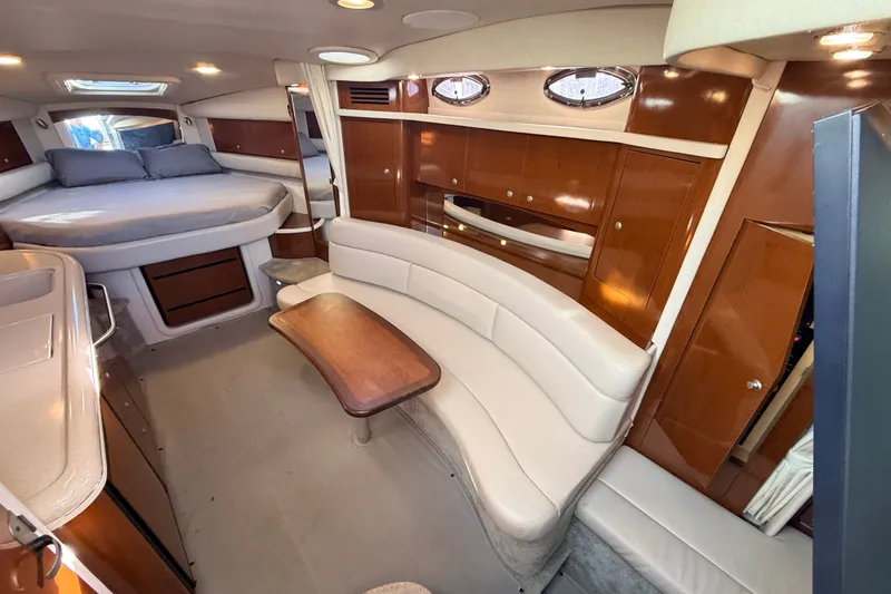 Slide: The Image of Luxurious interior of a 2008 Sea Ray 340 Sundancer yacht with elegant seating and wood finishes. - 23