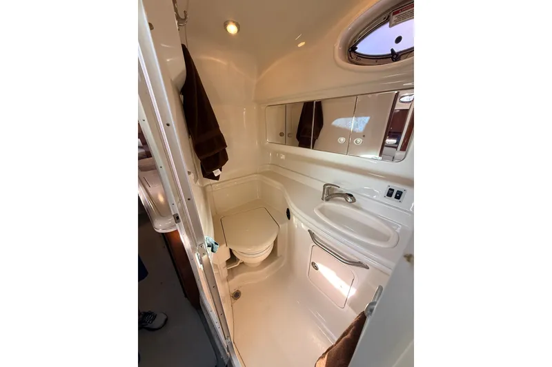 Slide: The Image of Bathroom interior of 2008 Sea Ray 340 Sundancer yacht, featuring sink and toilet. - 34
