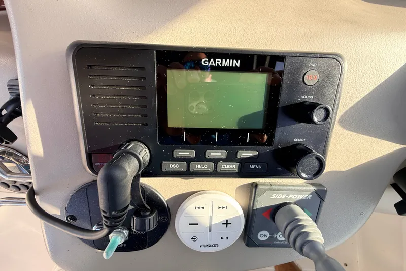 Slide: The Image of Control panel of a 2008 Sea Ray 340 Sundancer with Garmin and Side-Power systems. - 19
