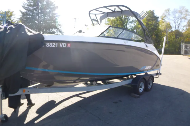 Slide: The Image of 2022 Yamaha Boats AR250 on trailer, parked outdoors in sunny setting. - 3