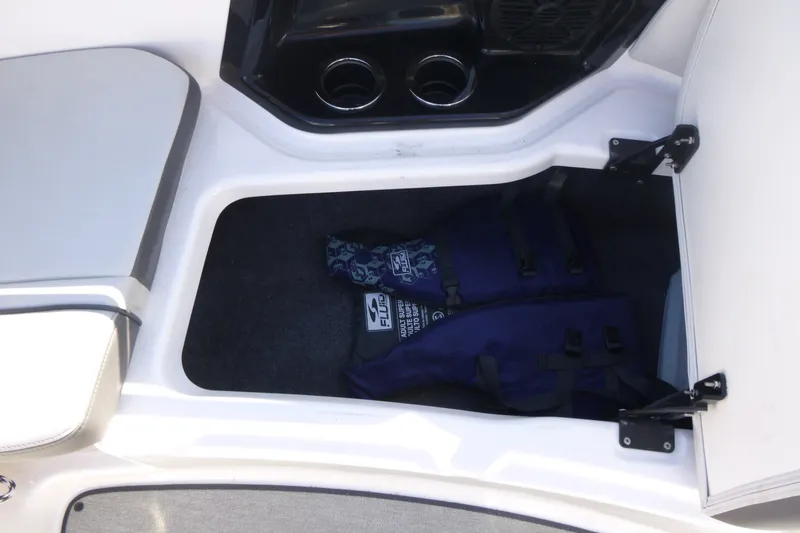 Slide: The Image of Storage compartment in 2022 Yamaha AR250 boat with life jackets inside. - 8