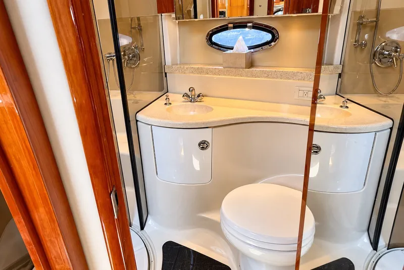 Slide: The Image of Luxurious bathroom in 2009 Regal 4080 Sportyacht with dual sinks and modern fixtures. - 10