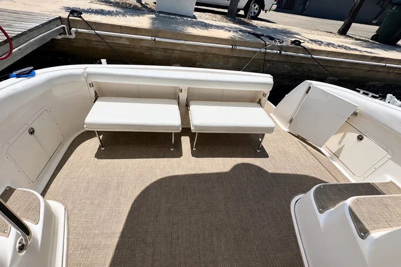 Slide: The Image of 2009 Regal 4080 Sportyacht interior with beige seating and carpeted deck. - 5