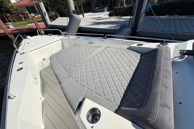 Slide: The Image of 2018 Axopar 37 Sports Cabin with spacious, cushioned seating area at the bow. - 29