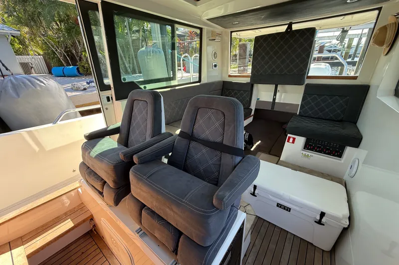 Slide: The Image of Interior of 2018 Axopar 37 Sports Cabin with plush seating and modern design. - 17