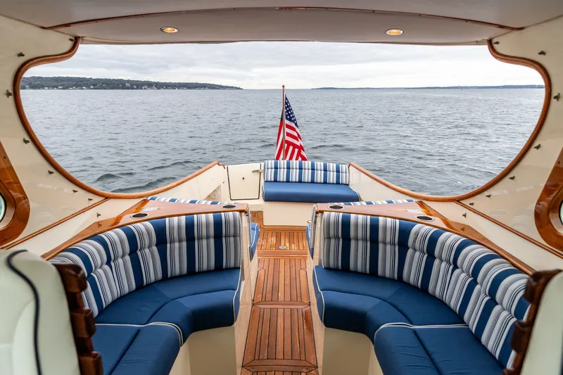 Slide: The Image of Luxurious 2013 Hinckley Talaria 34 yacht interior with striped seating and ocean view. - 17