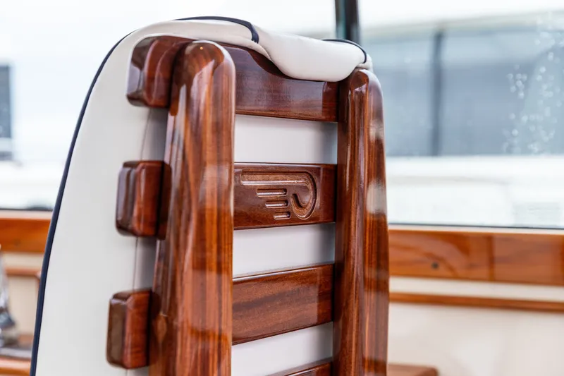 Slide: The Image of Wooden seat detail on 2013 Hinckley Talaria 34 boat, showcasing craftsmanship and luxury. - 21