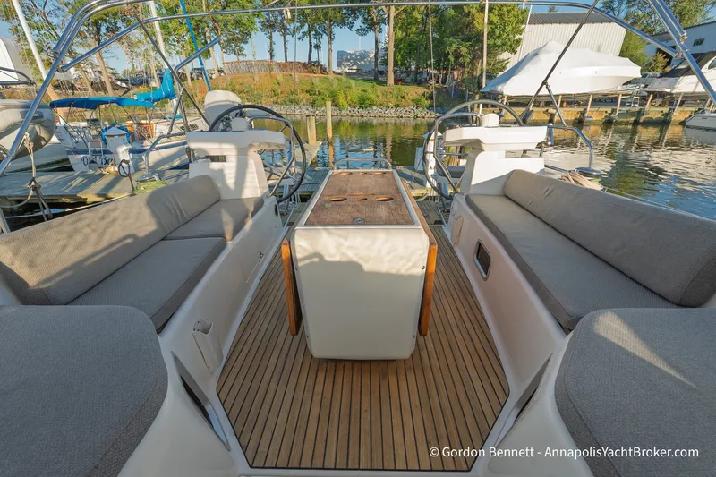 Slide: The Image of Spacious cockpit of 2020 Jeanneau 51 yacht with comfortable seating and elegant wood finish. - 13