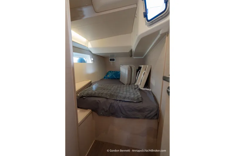 Slide: The Image of Interior cabin of 2020 Jeanneau 51 yacht, featuring a cozy bed and modern design. - 34