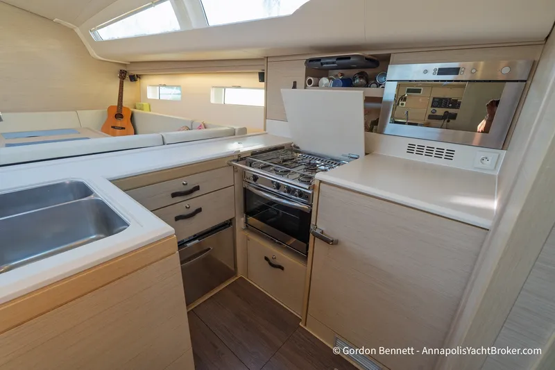 Slide: The Image of Modern kitchen interior of 2020 Jeanneau 51 yacht with stove and sink. - 23