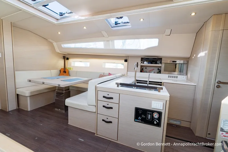 Slide: The Image of Modern interior of 2020 Jeanneau 51 yacht with kitchen and seating area. - 26