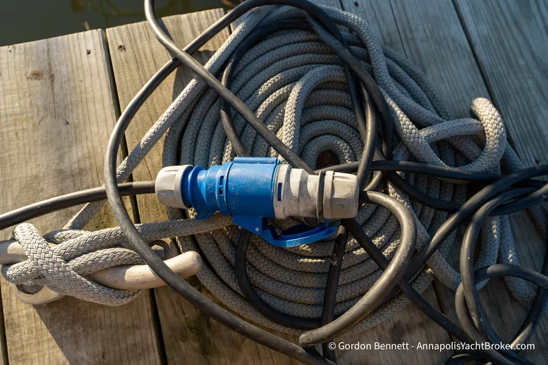 Slide: The Image of Coiled ropes and electrical cable on dock, Jeanneau 51 yacht, 2020 model. - 41