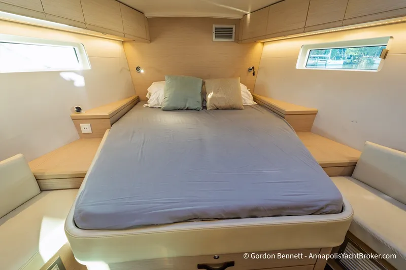 Slide: The Image of Luxurious cabin interior of a 2020 Jeanneau 51 yacht with a comfortable bed. - 29