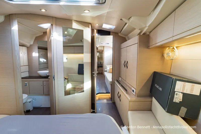 Slide: The Image of Luxurious interior of a 2020 Jeanneau 51 yacht, featuring modern design and spacious layout. - 30