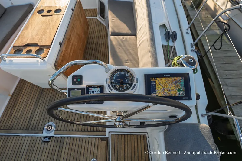 Slide: The Image of Steering wheel and navigation system on 2020 Jeanneau 51 yacht deck. - 16