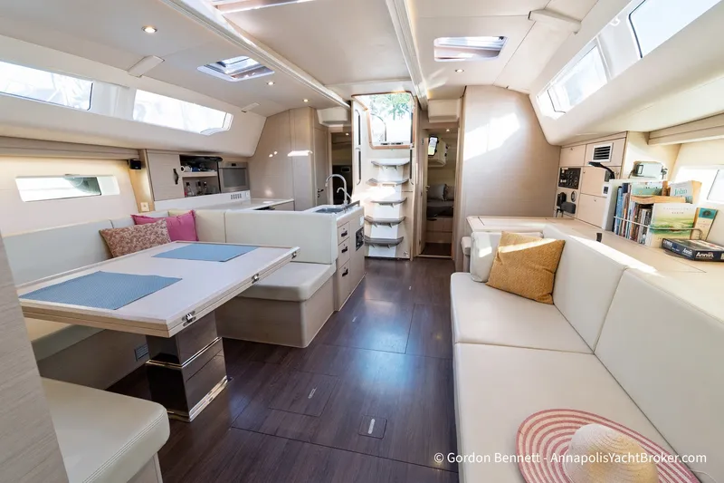Slide: The Image of Luxurious interior of a 2020 Jeanneau 51 yacht with modern furnishings and ample natural light. - 27