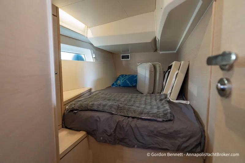 Slide: The Image of Cozy cabin interior of 2020 Jeanneau 51 yacht with modern furnishings and soft lighting. - 33