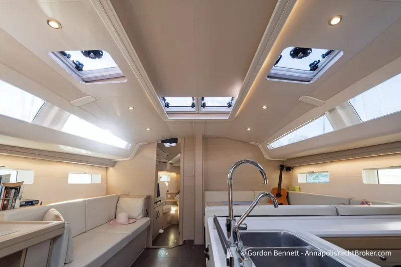 Slide: The Image of Luxurious interior of a 2020 Jeanneau 51 yacht with modern furnishings and skylights. - 20