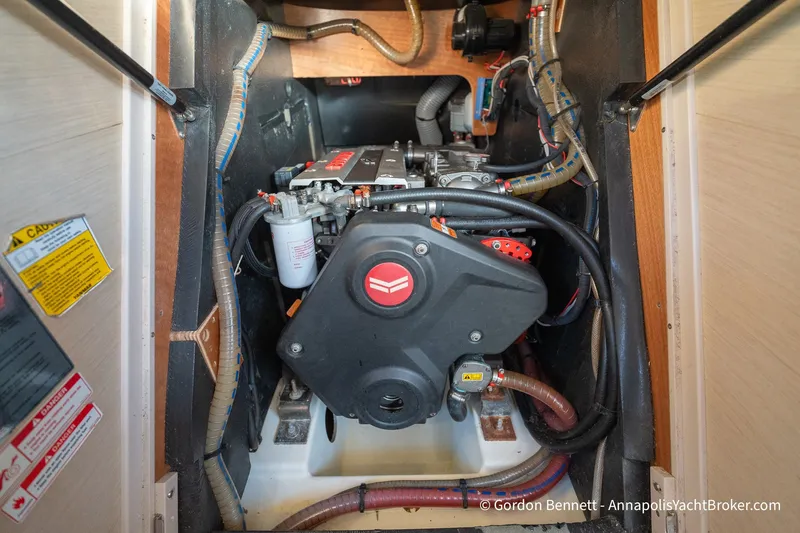 Slide: The Image of Engine compartment of a 2020 Jeanneau 51 yacht, showcasing detailed mechanical components. - 42