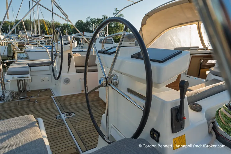 Slide: The Image of Cockpit of 2020 Jeanneau 51 yacht with dual steering wheels and teak decking. - 15