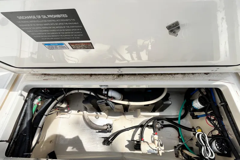 Slide: The Image of Engine compartment of a 2006 Boston Whaler 285 Conquest boat, showing wiring and components. - 20