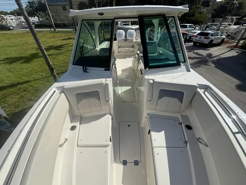 Slide: The Image of 2025 Sailfish 316 DC boat interior with seating and storage compartments. - 16