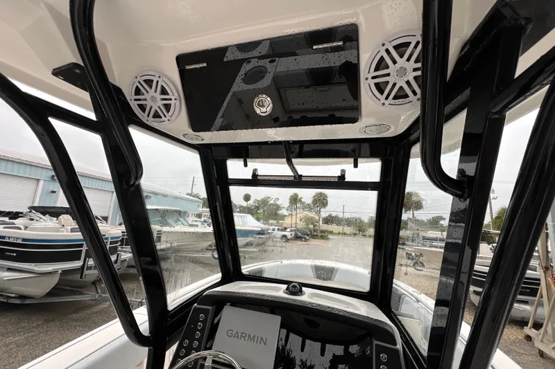 Slide: The Image of 2027 Robalo R250 Center Console boat interior with Garmin electronics and speakers. - 20