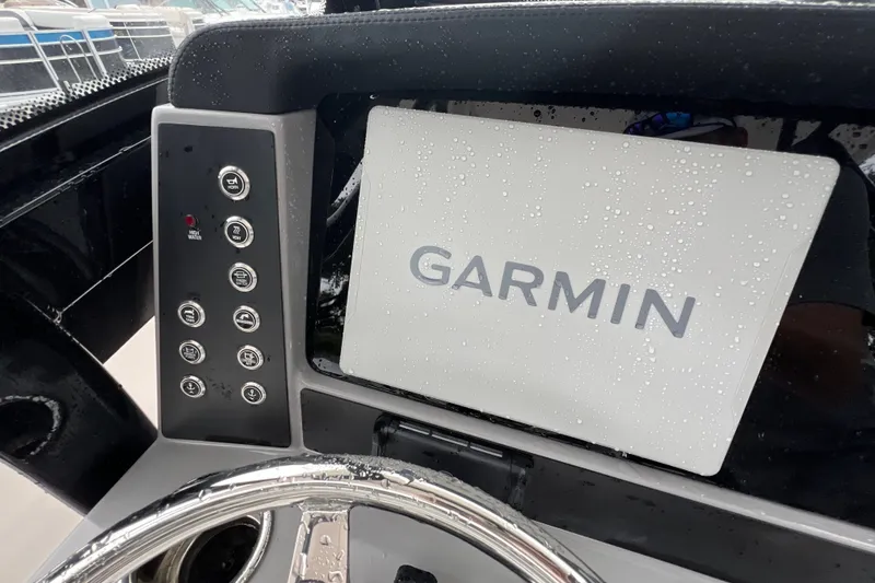 Slide: The Image of 2027 Robalo R250 Center Console with Garmin display and control panel. - 17
