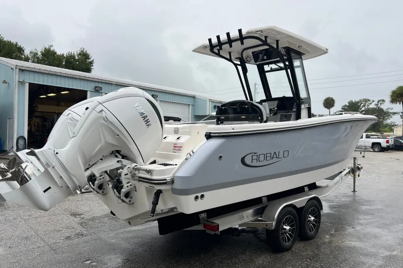 The Image of 2027 Robalo R250 Center Console boat with Yamaha engine on trailer. - 0