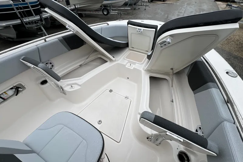 Slide: The Image of 2027 Robalo R250 Center Console boat interior with open storage compartments and seating. - 23