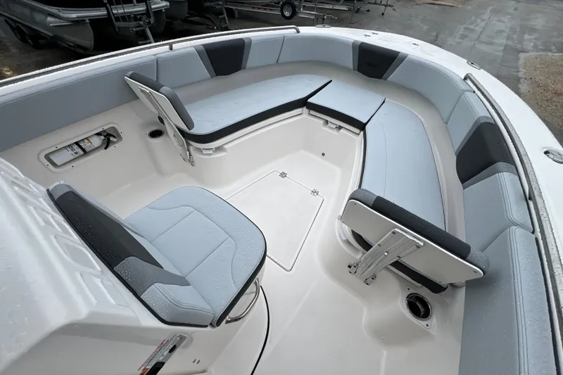 Slide: The Image of 2027 Robalo R250 Center Console boat interior with cushioned seating and storage compartments. - 21