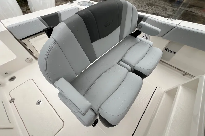 Slide: The Image of 2027 Robalo R250 Center Console boat seat with gray upholstery and armrests. - 15