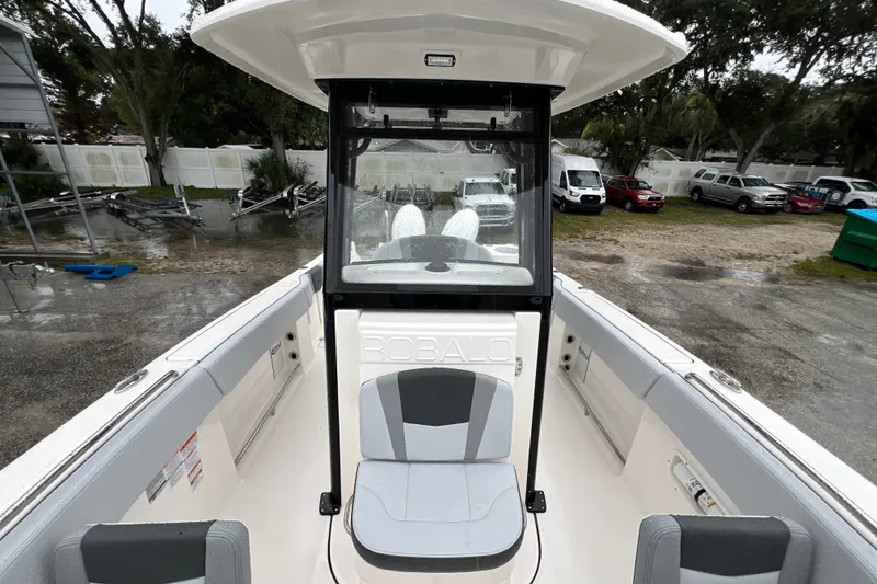 Slide: The Image of 2027 Robalo R250 Center Console boat interior with seating and console view. - 24