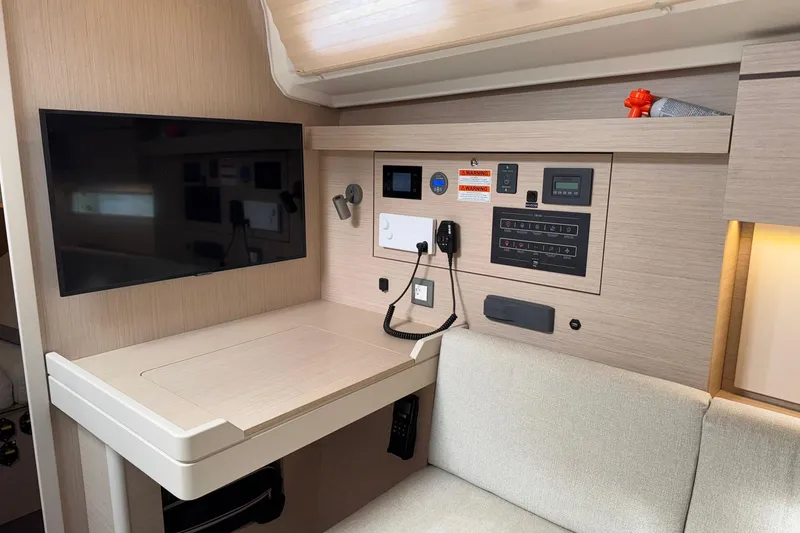 Slide: The Image of Interior of 2022 Beneteau Oceanis 40.1 yacht with control panel and TV. - 35