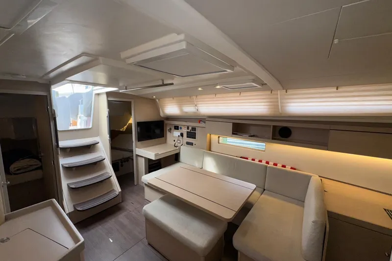 Slide: The Image of Modern interior of 2022 Beneteau Oceanis 40.1 yacht, featuring cozy seating and sleek design. - 26