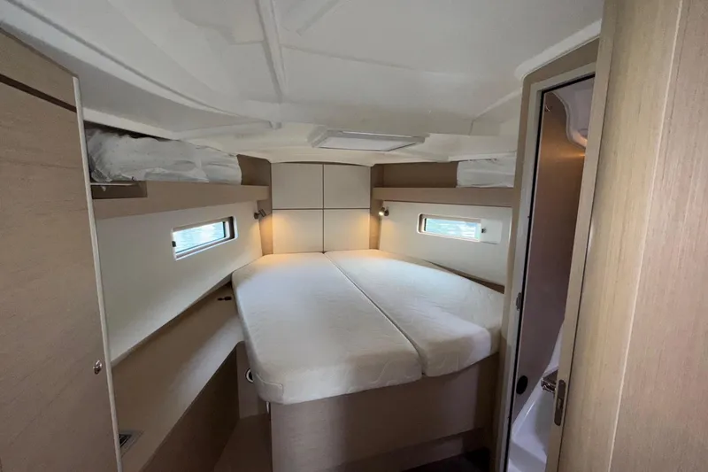 Slide: The Image of Interior cabin of 2022 Beneteau Oceanis 40.1 yacht, featuring a cozy double bed. - 37