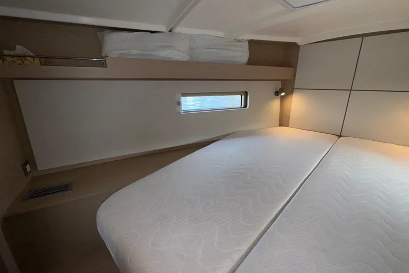 Slide: The Image of Interior cabin of 2022 Beneteau Oceanis 40.1 yacht with cozy bedding. - 36