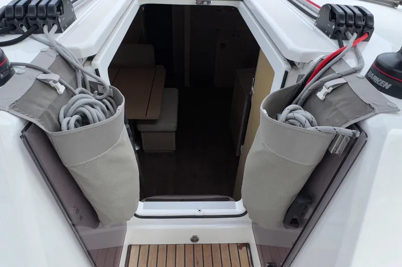 Slide: The Image of 2022 Beneteau Oceanis 40.1 yacht cockpit entrance with rope storage bags. - 23