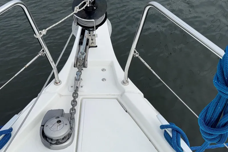 Slide: The Image of Bow of 2022 Beneteau Oceanis 40.1 sailboat with anchor chain and blue rope. - 18
