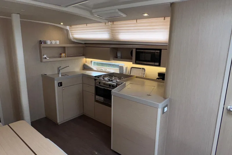 Slide: The Image of Modern kitchen interior of 2022 Beneteau Oceanis 40.1 yacht with sleek cabinetry and appliances. - 28