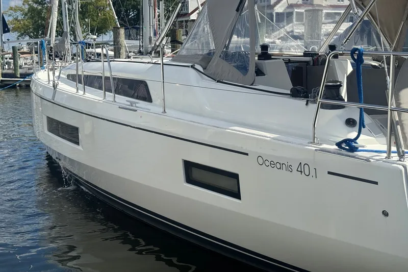 Slide: The Image of 2022 Beneteau Oceanis 40.1 sailboat docked at marina, side view. - 50