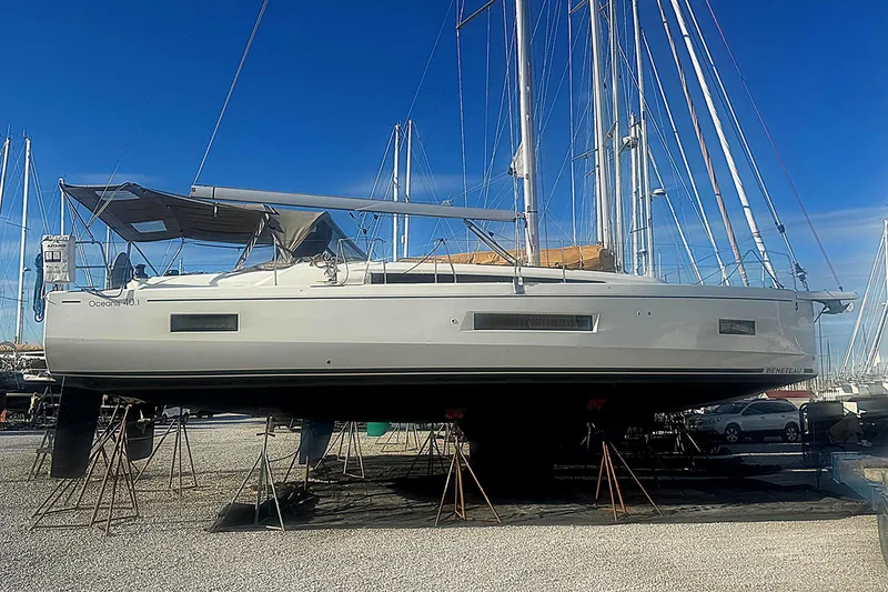 Slide: The Image of 2022 Beneteau Oceanis 40.1 sailboat on stands, clear blue sky background. - 51