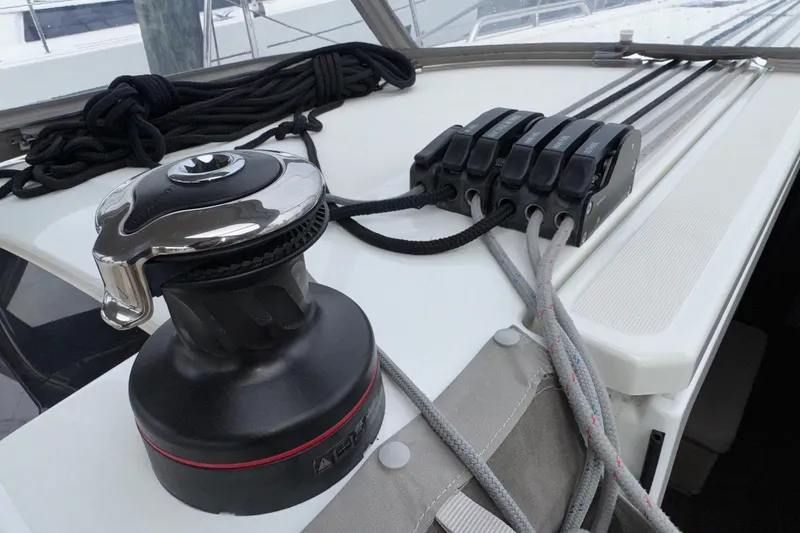 Slide: The Image of Winch and rope clutches on 2022 Beneteau Oceanis 40.1 sailboat deck. - 15